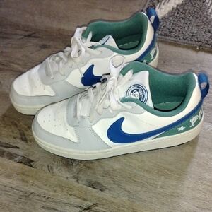 Nike Kids White Sneakers with Blue Swoosh and Green Lining